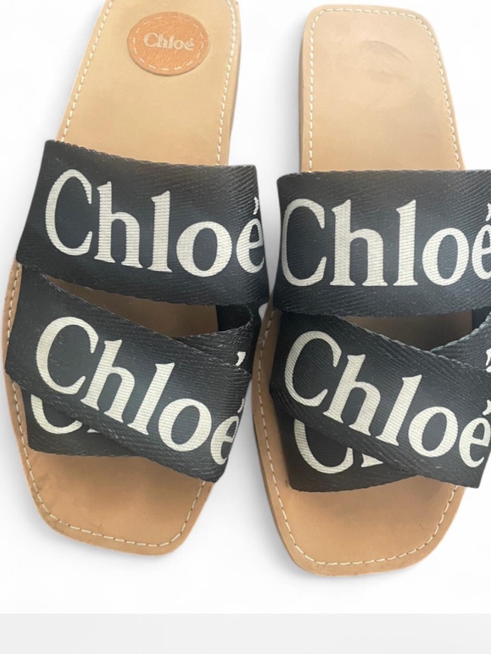 Chloe logo slide sandals- black canvas straps and tan footbed
Size 9